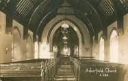 The interior of the church - with banners of texts over the side windows