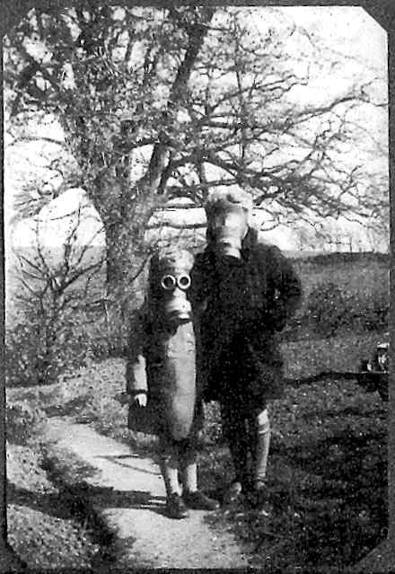 Carol and Pam wearning their gas-masks at Brook Cottage