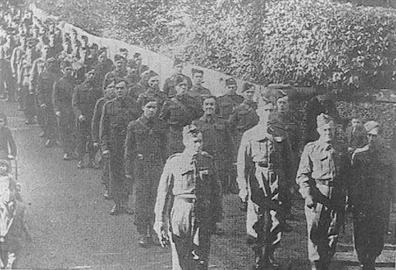 'The Arborfield and Winnersh Home Guard marching to the Remembrance Day service'