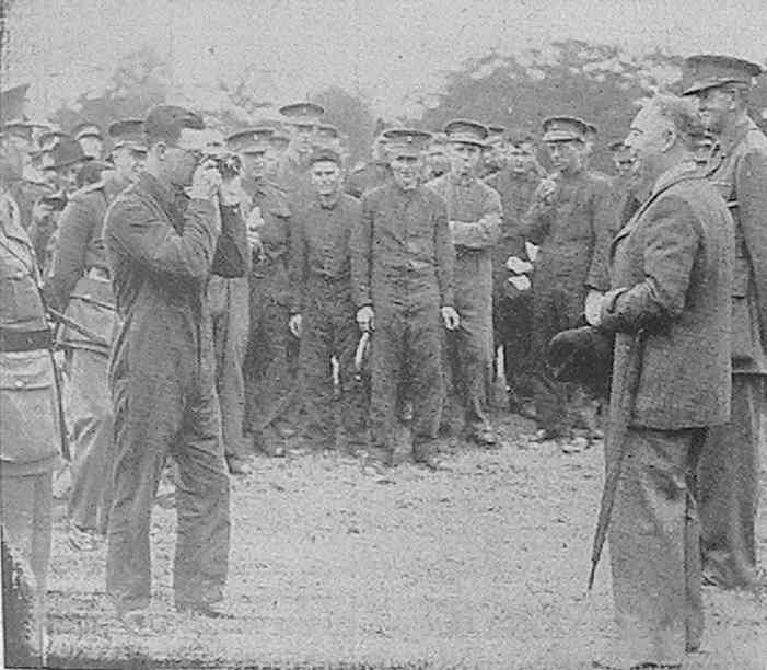 Mr. Hore-Belisha, the Secretary for War, posing for a photograph at the Militia camp